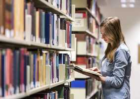 Economics_PhD_Student_Reading_In_Library.jpg