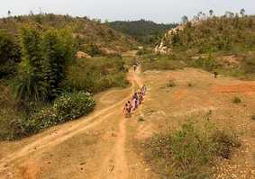 people walking through African landscape