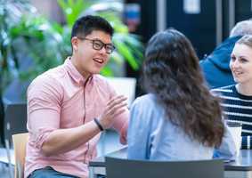 Students chatting at a table
