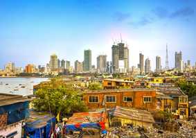 landscape of favela and skyscrapers on coastline