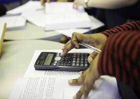 person using calculator