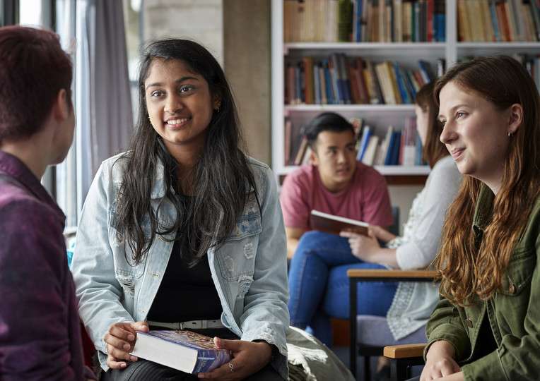 Student-visa-support-group-of-students-smiling-in-the-library.jpg