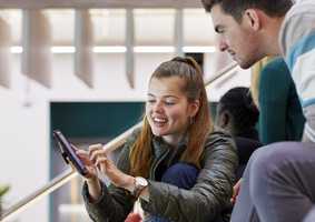 Students looking at phone screen
