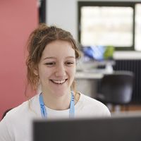 featured_jobs_staff_smiling_at_computer.jpg