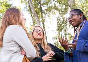 three students by trees