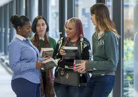 students chatting in corridor