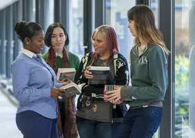 students chatting in corridor