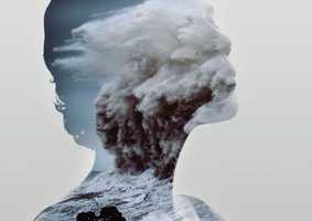 silhouette of a head with ocean waves inside