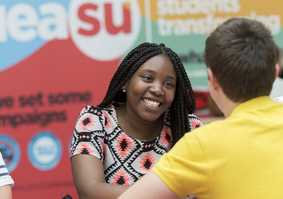 students talking in the Students' Union on campus