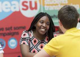 students talking in the Students' Union on campus