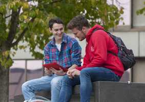 Students looking at an ipad
