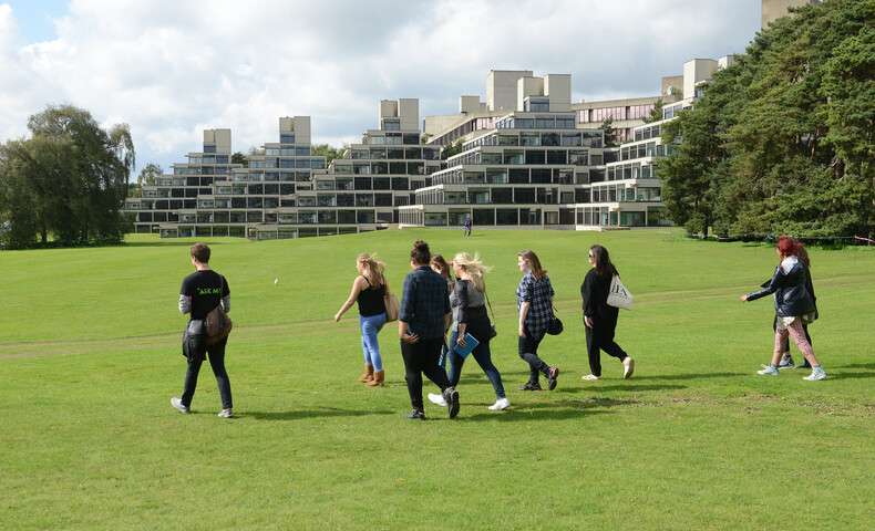 campus-tour-group-of-people-walking-on-campus-with-ziggurat-accommodation-in-background_4562.jpg