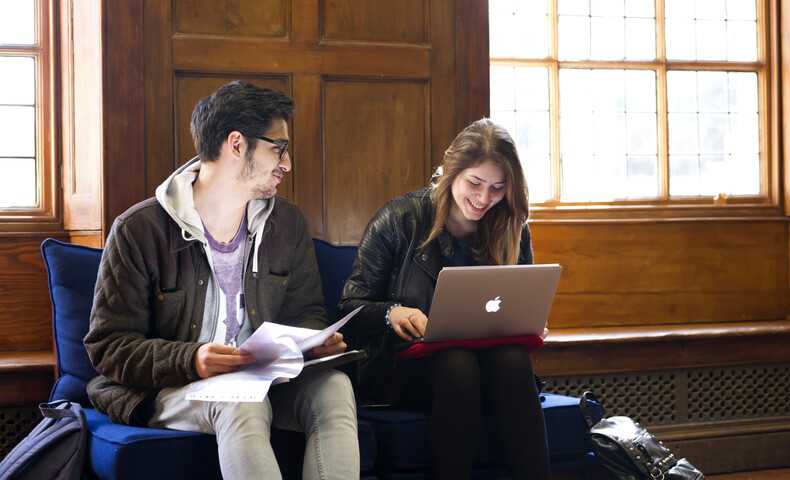 law-students-smiling-with-books-and-laptop_4028.jpg