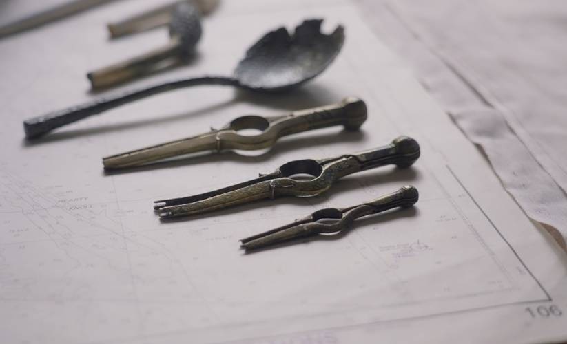 Conserved items including spoon, pipes