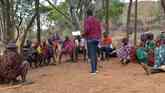 Staff from Karamoja Development Forum meeting with Tepeth Community
