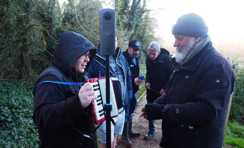 A group meets with artist Ian Brownlie