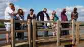 A group meets on the bridge at Burgh Castle