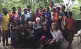 Village and Scientists posing after discussions on the future
