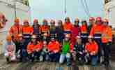 Women on boat in hard-hats