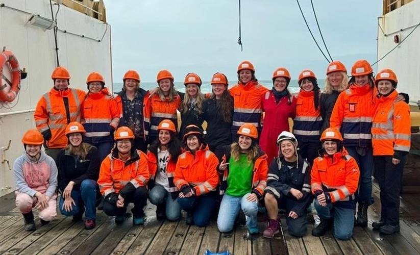 Women on boat in hard-hats