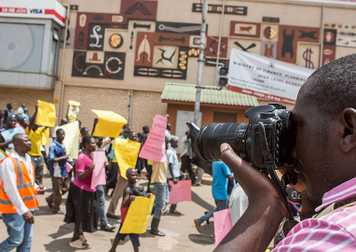 photographer-covering_a_march_in_Kampala_Uganda (2).jpg