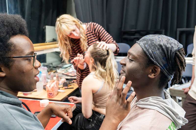 Students preparing for a show.