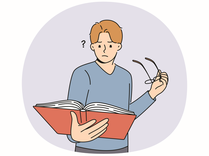 confused man reading book