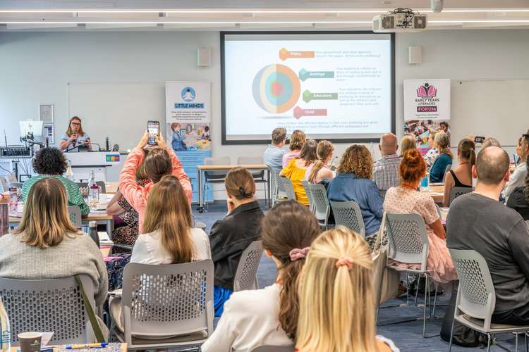 Image of audience watching a presentation