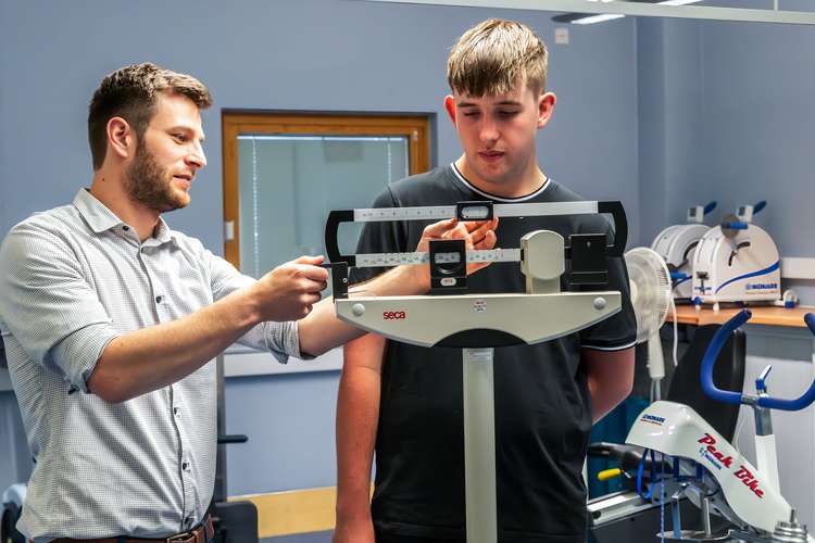 Person standing on weighing scales in MoveX Lab