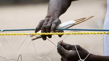 DEV_person_repairing_fishing_nets.jpg