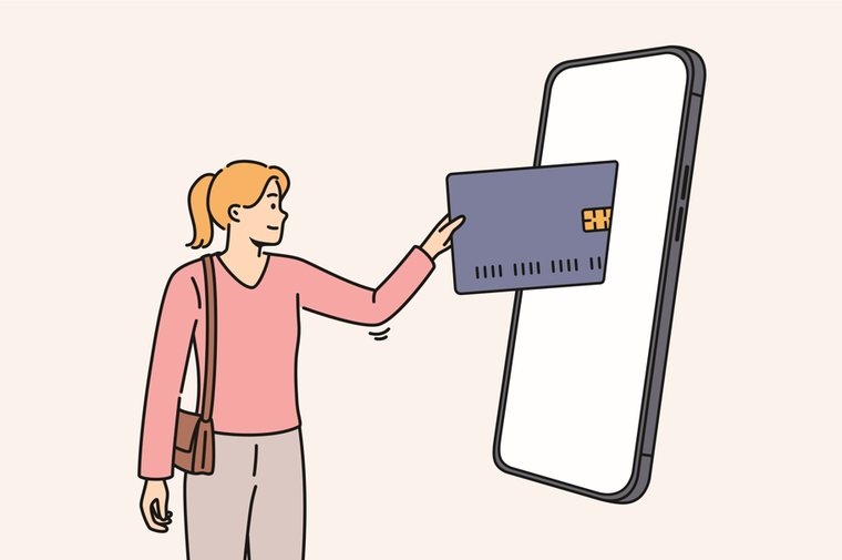 woman inserting card into large phone