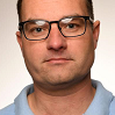A headshot of Garry Barton