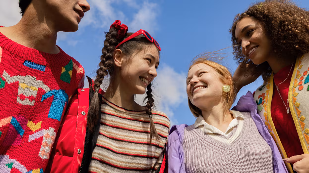 four young people in circle